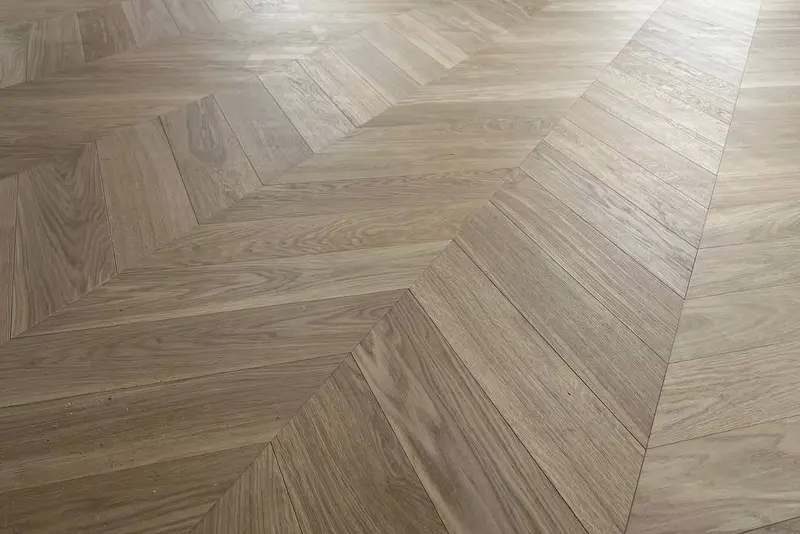 Herringbone 5×25", Soft White, Yorkville hardwood flooring project by Floors Toronto