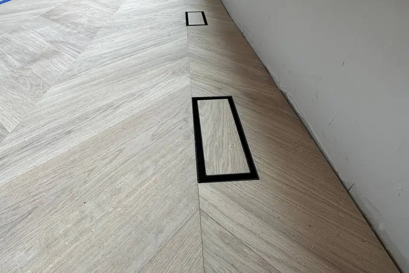 Herringbone 5×25", Soft White, Yorkville hardwood flooring project by Floors Toronto