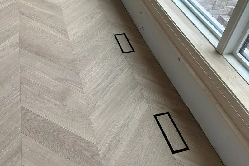Herringbone 5×25", Soft White, Yorkville hardwood flooring project by Floors Toronto