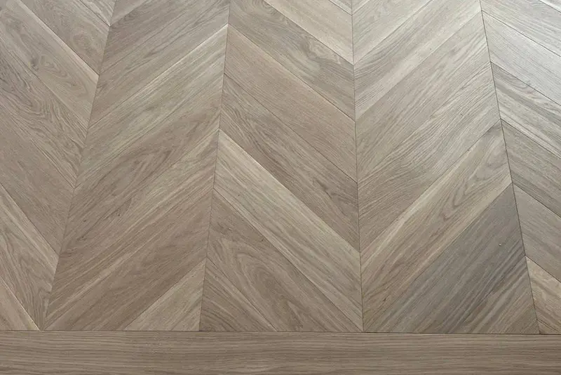 Herringbone 5×25", Soft White, Yorkville hardwood flooring project by Floors Toronto